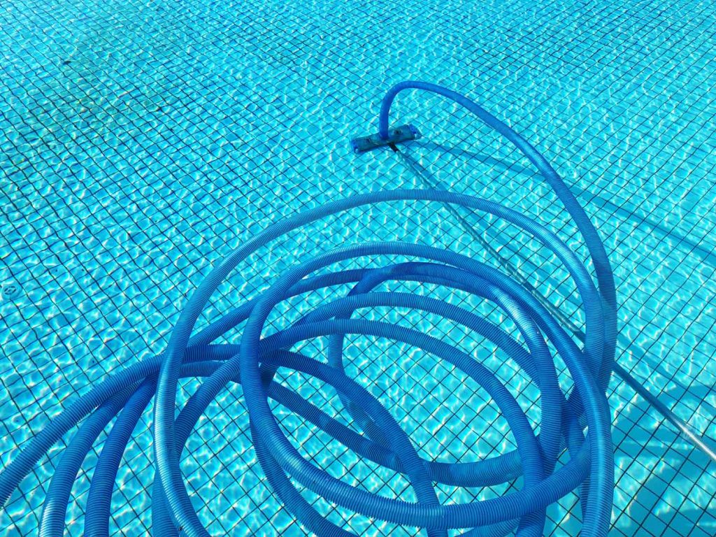 cleaning tubes in a swimming pool